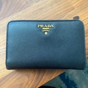 Prada black saffiano leather zip bifold wallet